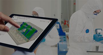 cleanroom design shown on a tablet with the background of an actual cleanroom