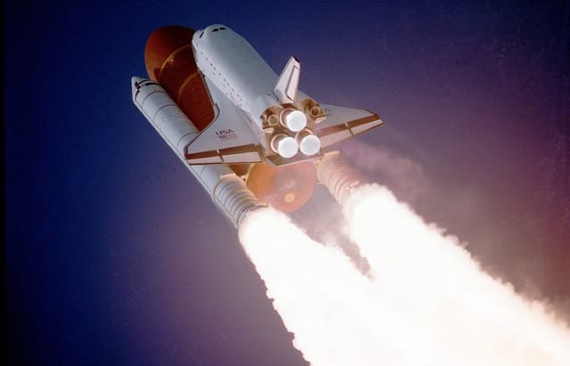 Space shuttle taking off