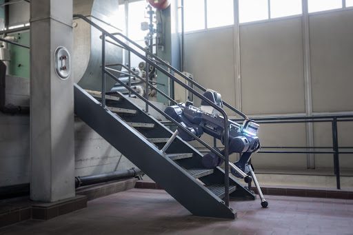 ANYbotics autonomous robot ANYmal X climbing stairs to perform inspection in an industrial setting