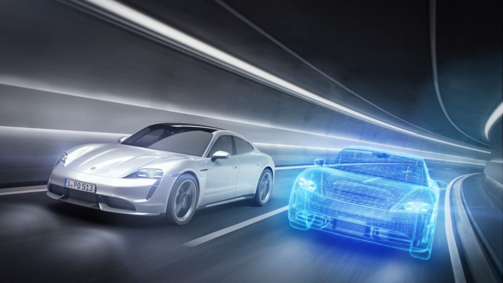 A digital twin of a Porsche car placed on the road next to the actual car moving fast through a tunnel